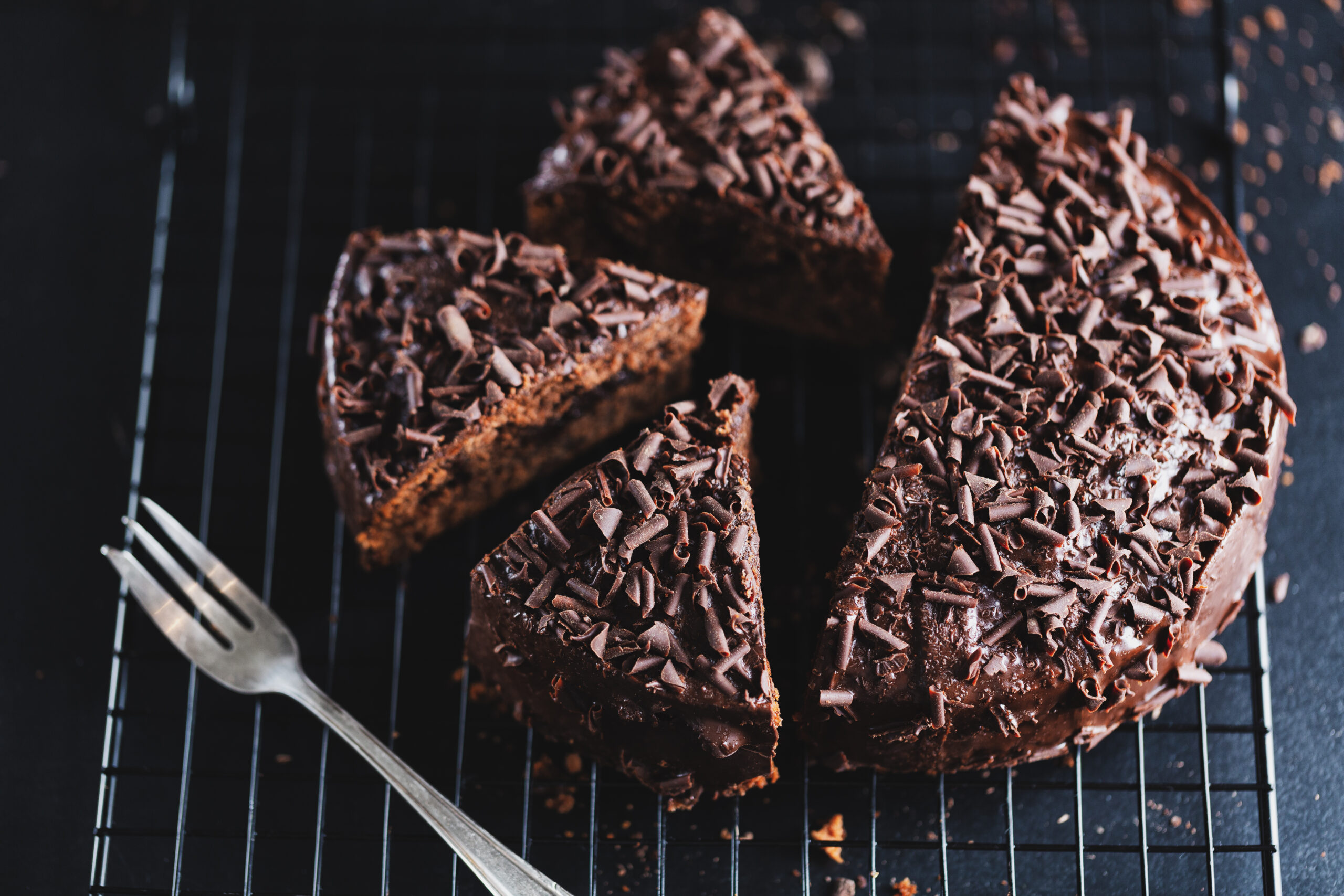 closeup tasty chocolate cake with chocolate chunks baking sheet scaled